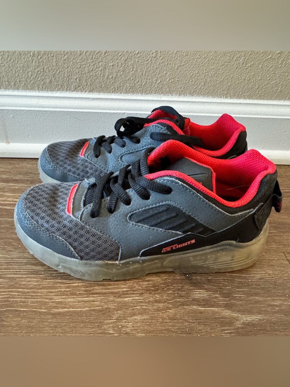 Kids Skechers Black & Gray Sneakers with Red Lining and light up soles